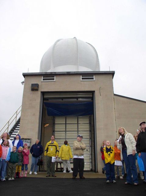 NWS WFO DTX employees David Shuler, Birdie Nash, and David Koehler (left to right) turn their eyes to the sky, to watch a radiosonde balloon ascend in Picture