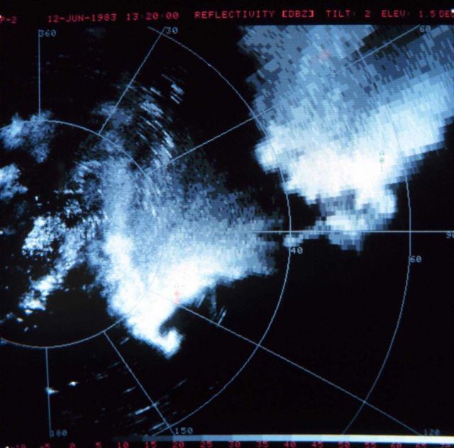 Classic appearing tornado hook echo on bottom of thunderstorm in lower left quadrant of scope Picture