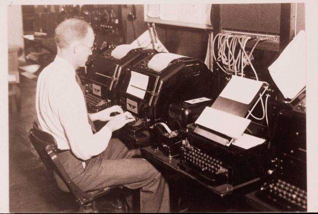 Using a teletypewriter to transmit weather information Picture