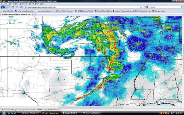 Classic comma-shaped system with tornadoes forming ESE of low-pressure center which is over western Kansas Picture