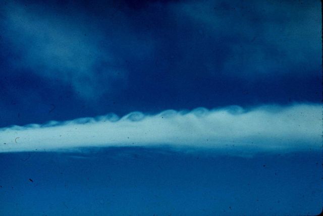 Clouds showing appearance of breaking waves east of the continental divide. Picture