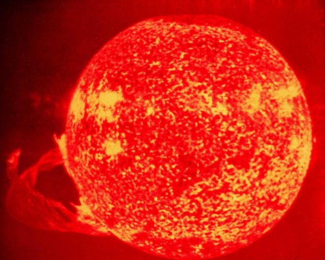 A huge solar flare on the bottom left of the photograph. Picture