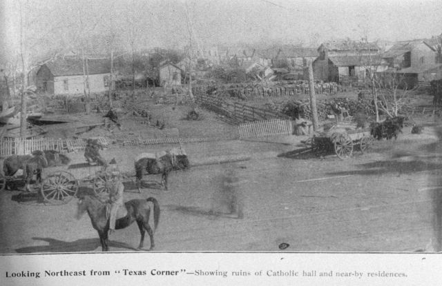 Looking northeast from Texas corner showing the wreck of the Catholic Hall and several residences Picture