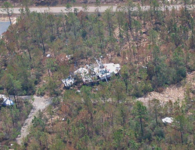 Commercial shrimp trawlers tossed among destroyed homes on north shoreline of St Picture