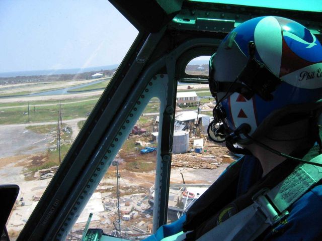 LT Phil Eastman hovering over damaged oil tank. Picture