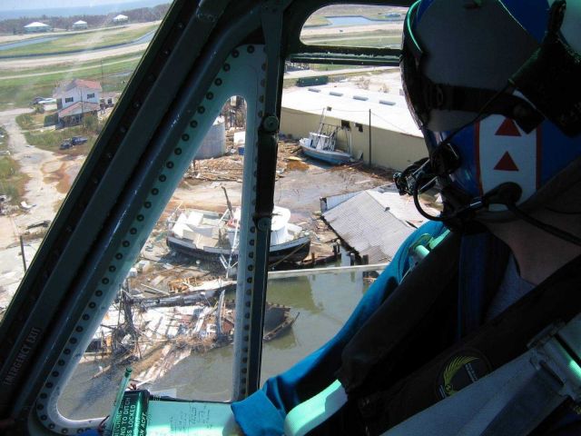 LT Phil Eastman hovering over damaged oil tank. Picture