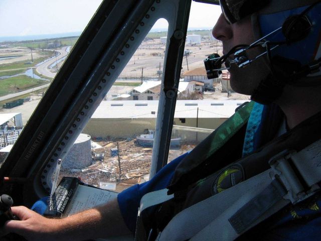 LT Phil Eastman hovering over damaged oil tank. Picture