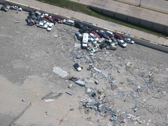 Remains of vehicles and a helicopter at Lakefront Airport. Picture