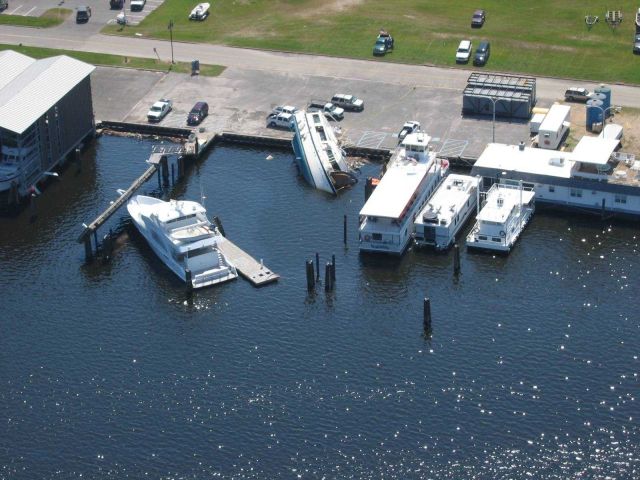 A curious effect of Hurricane Katrina left one boat on the pier while others appear to have escaped relatively unscathed. Picture