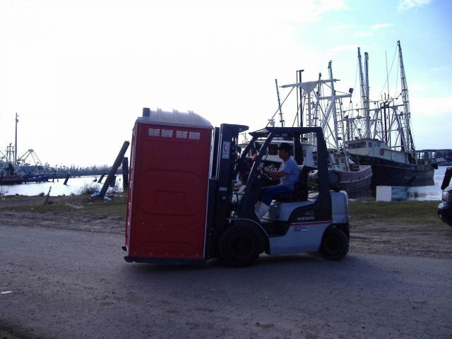Transporting portable relief station following passage of Hurricane Katrina. Picture