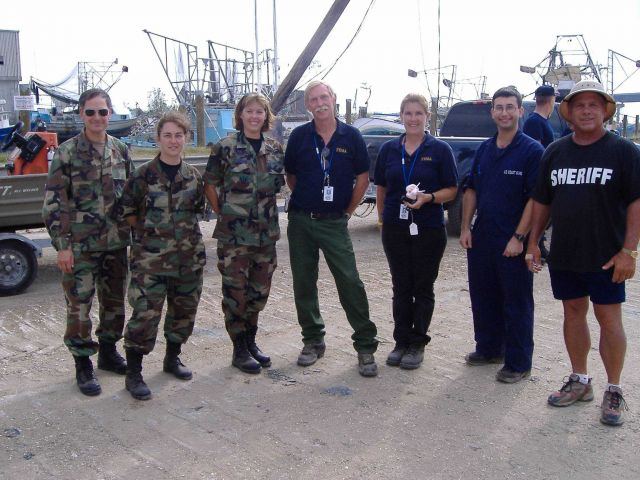 National Guardk FMA, and local sheriff working together to rebuild after Hurricane Katrina. Picture