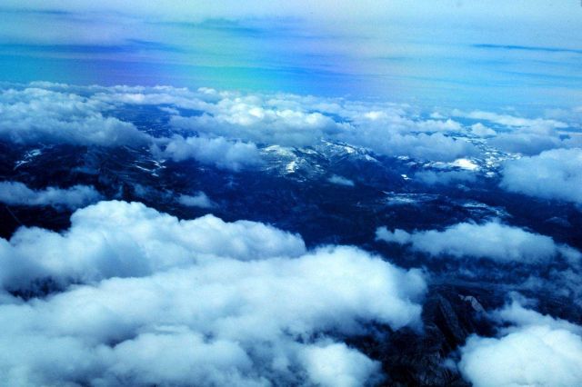Cumulus over the Rocky Mountains during snow survey operations. Picture