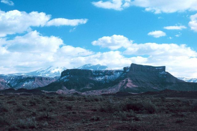 Mesas, mountains, and cumulus in the Colorado Plateau country. Picture