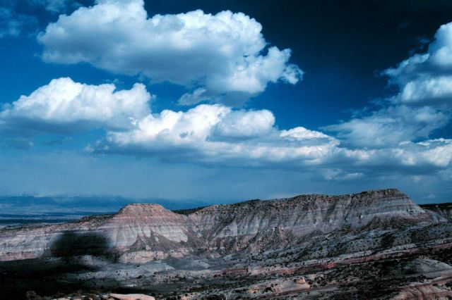 Cumulus over gently tilted strata in the Colorado Plateau country. Picture