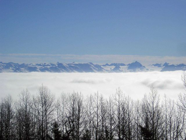 Clouds at Homer obscure the coastline as seen from Kachemak Bay. Picture