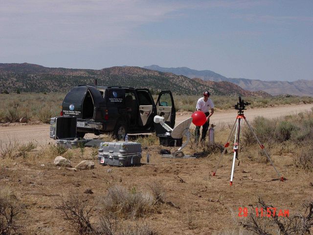 Incident Meteorologist Chris Jordan prepares a PIBAL for launch to monitor winds on the Reilly Fire in southern Utah Picture