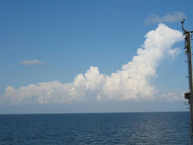 While the TAO buoy streams aft, innocent looking clouds approach Picture