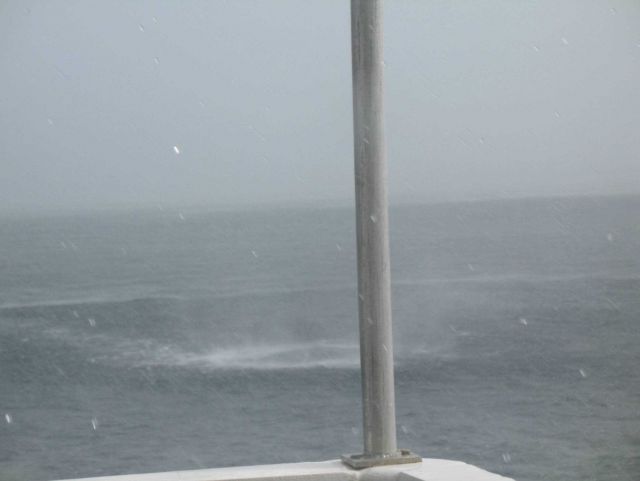Waterspout sequence as the spray from a waterspout approaches the NOAA Ship GORDON GUNTER which is constrained in its ability to maneuver as the recen Picture