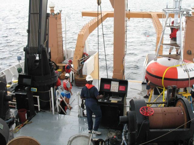 Following passage of the waterspout, the crew prepares to drop the anchor for the TAO buoy Picture