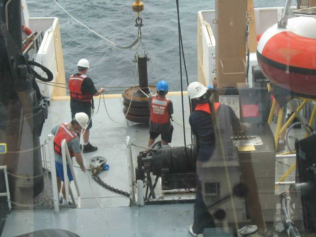 Following passage of the waterspout, the crew prepares to drop the anchor for the TAO buoy Picture