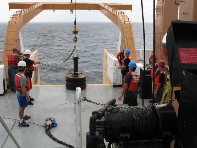Following passage of the waterspout, the crew prepares to drop the anchor for the TAO buoy Picture
