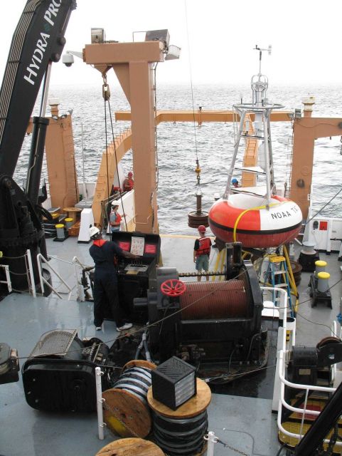 Following passage of the waterspout, the crew prepares to drop the anchor for the TAO buoy Picture