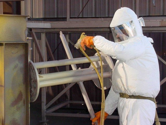 Coatings Specialist, James Payton, painting buoy components. Picture