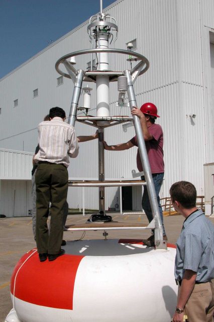 Engineers with TAO Buoy. Picture