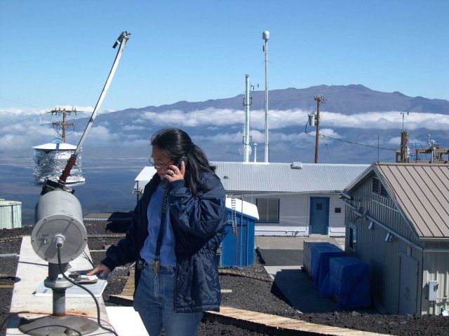 The late Leslie Pajo checks a sunlight measuring instrument at Mauna Loa Observatory Picture