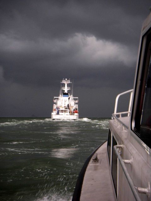 NOAA Ship THOMAS JEFFERSON seen from survey launch 3102 as squall approaches off the Virginia Capes. Picture