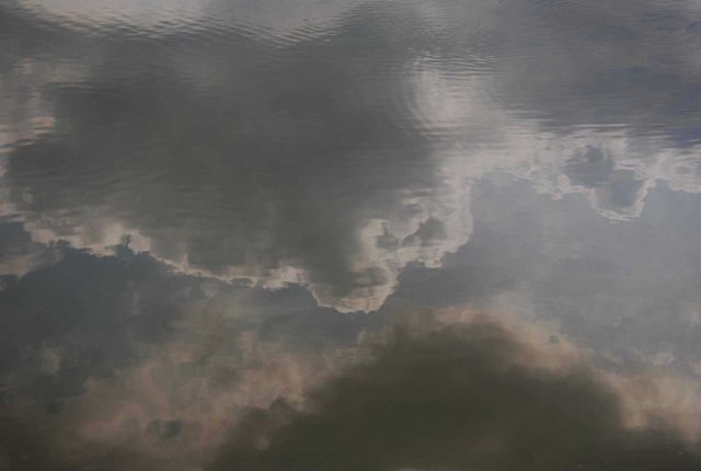 Cloud reflections on a still summer day. Picture