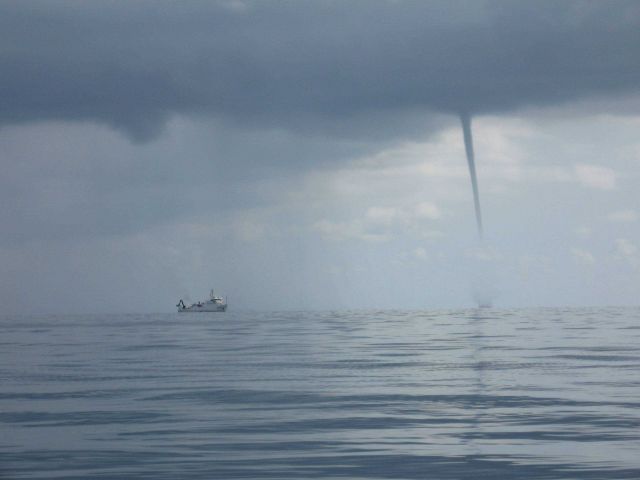 NOAA Ship NANCY FOSTER dwarfed by waterspout Picture