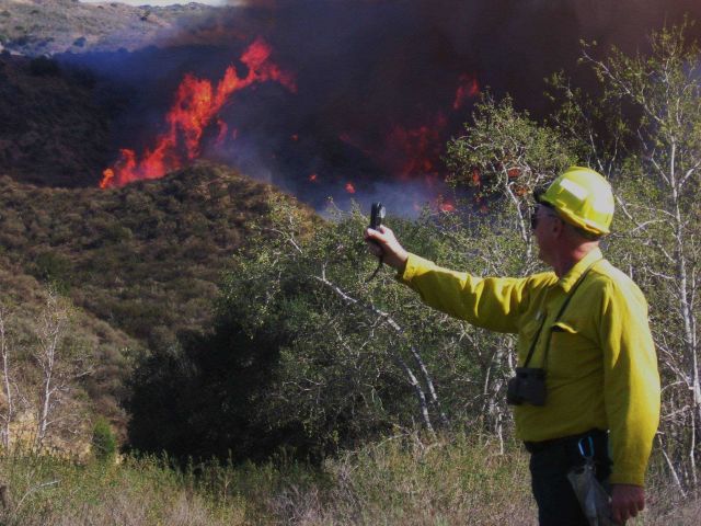 Meteorologist monitoring relative humidity and other parameters for fire weather forecasting. Picture