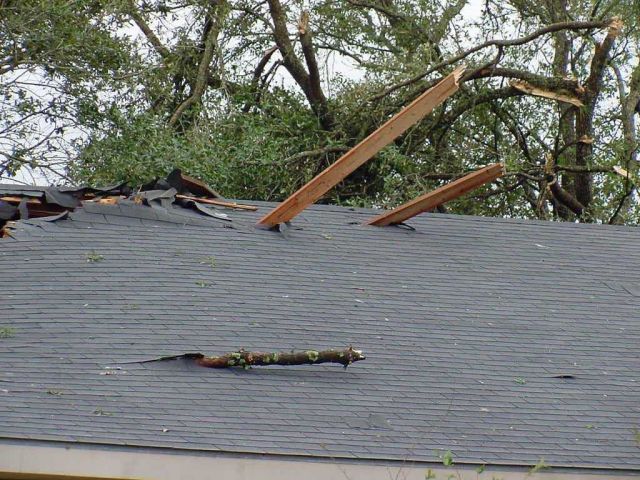 Roof impaled by flying debris during tornado Picture