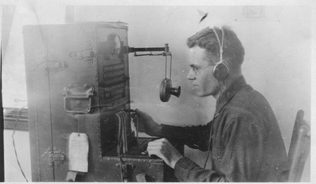 Signal Corps communications specialist using state of the art equipment to transmit and acquire weather information Picture