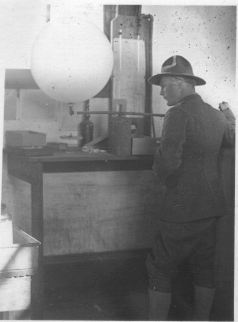Signal Corps meteorological student Bly inflating a weather balloon. Picture