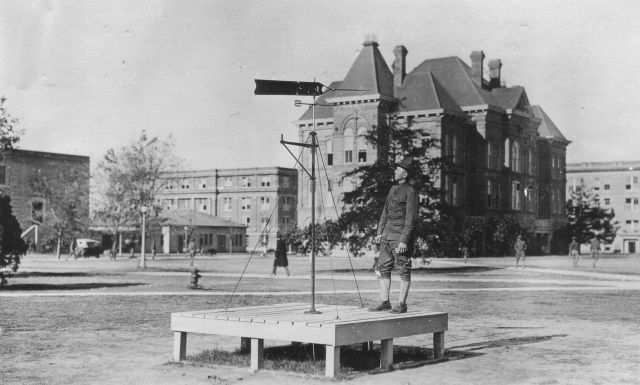 Signal Corps meteorological student Molyneaux determining which way the wind was blowing by means of a windvane. Picture