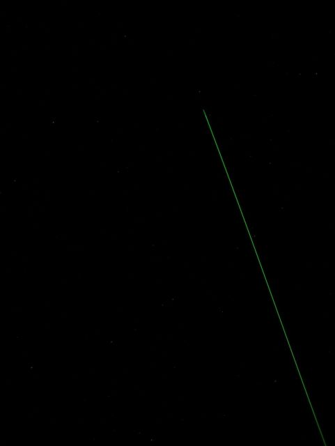 A green laser shooting into the night sky monitors various aerosols and particulate matter such as volcanic dust and various forms of air pollution in Picture