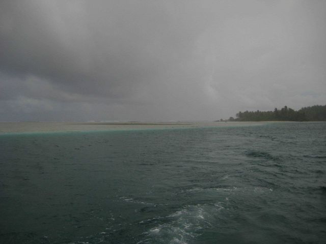 A tropical rain squall over Palmyra Island. Picture