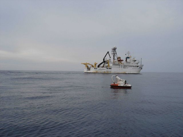 A DART II tsunami-warning buoy with the NOAA Ship OSCAR ELTON SETTE in the background. Picture