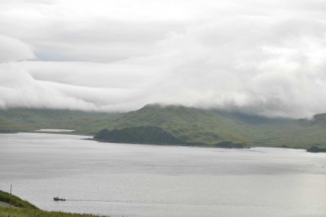 Clouds lying over mountains at Dutch Harbor. Picture