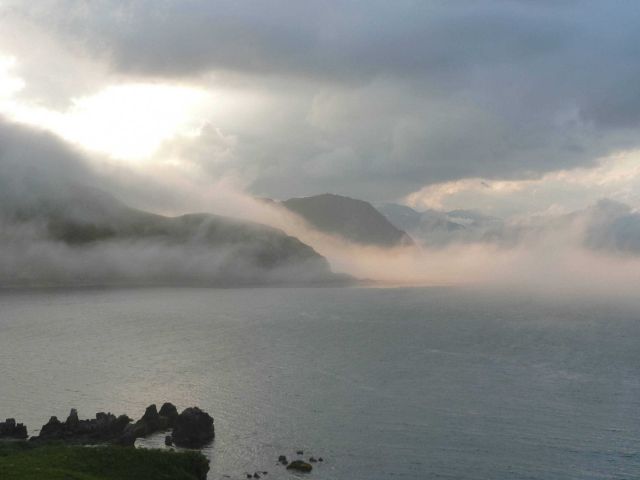 Fog streaming off the mountains of Dutch Harbor. Picture