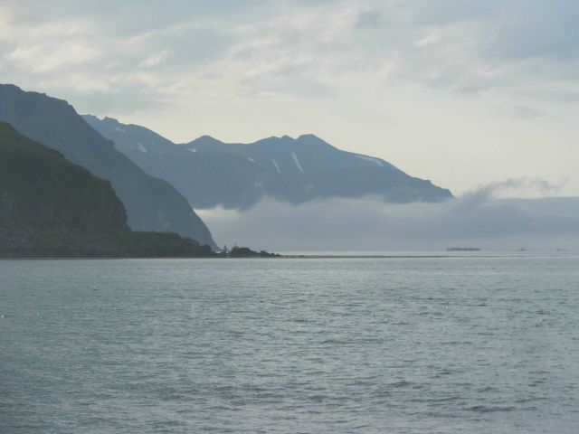 A ribbon of fog obscures the water level view in Glacier Bay. Picture