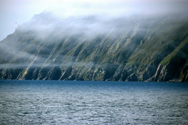 Wisps of fog appear like garlands over Little Diomede Island. Picture