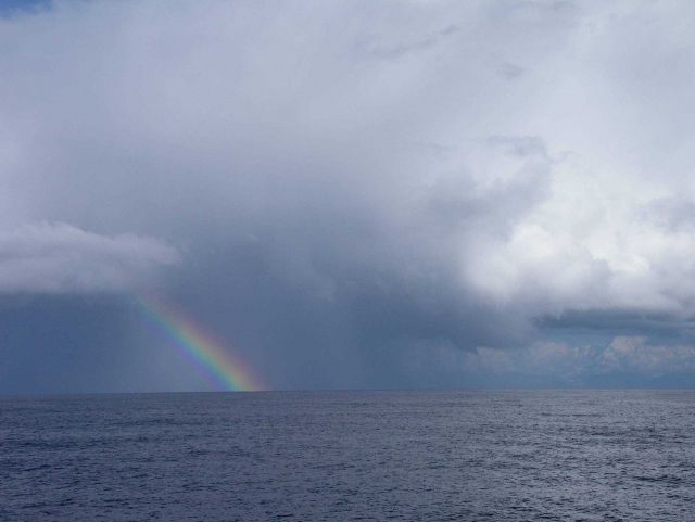 Rainbow seen at sea from off the Fairweather Range approaching Cape Spencer. Picture