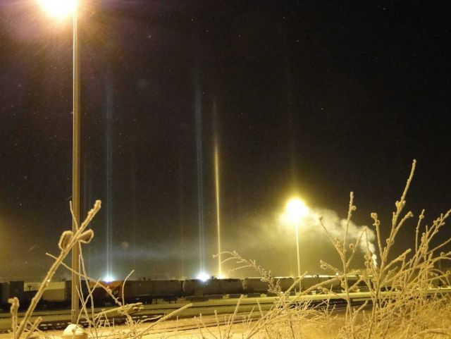 Light pillars penetrating ice fog at the Fairbanks train station Picture