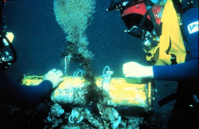 Underwater gear is maintained by divers to clear fouling and retrieve data. Picture