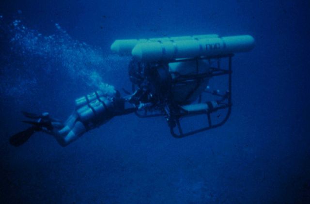 Divers use a two person diver propulsion vehicle. Picture