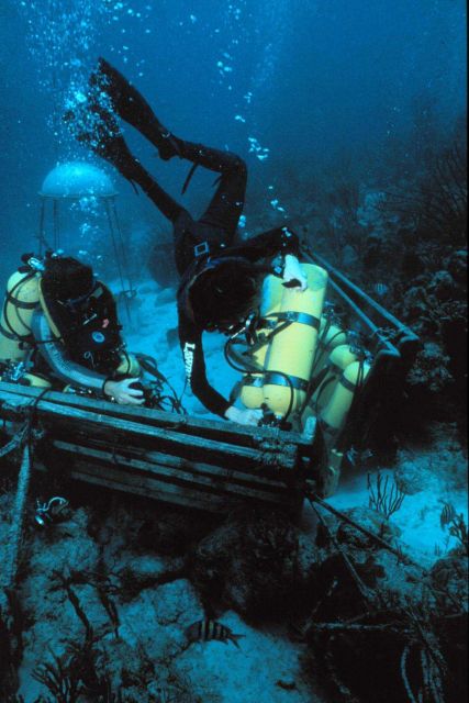 Aquanauts change out tanks near the Aquarius undersea laboratory. Picture