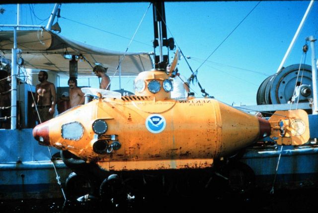 NEKTON GAMMA slung to the side of the support ship. Picture